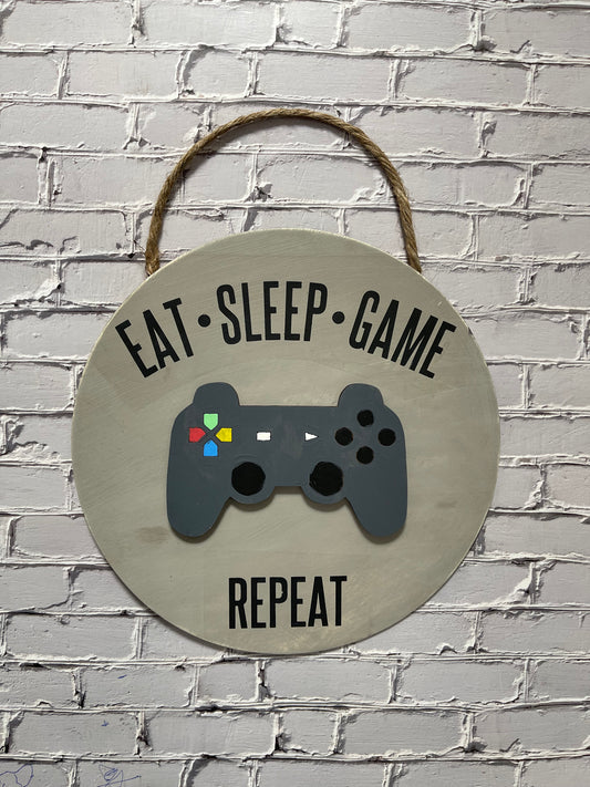 Eat Sleep Game Repeat Youth Door Hanger