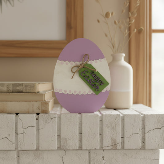 Decorative Easter egg with a 'Happy Easter' tag on a wooden background