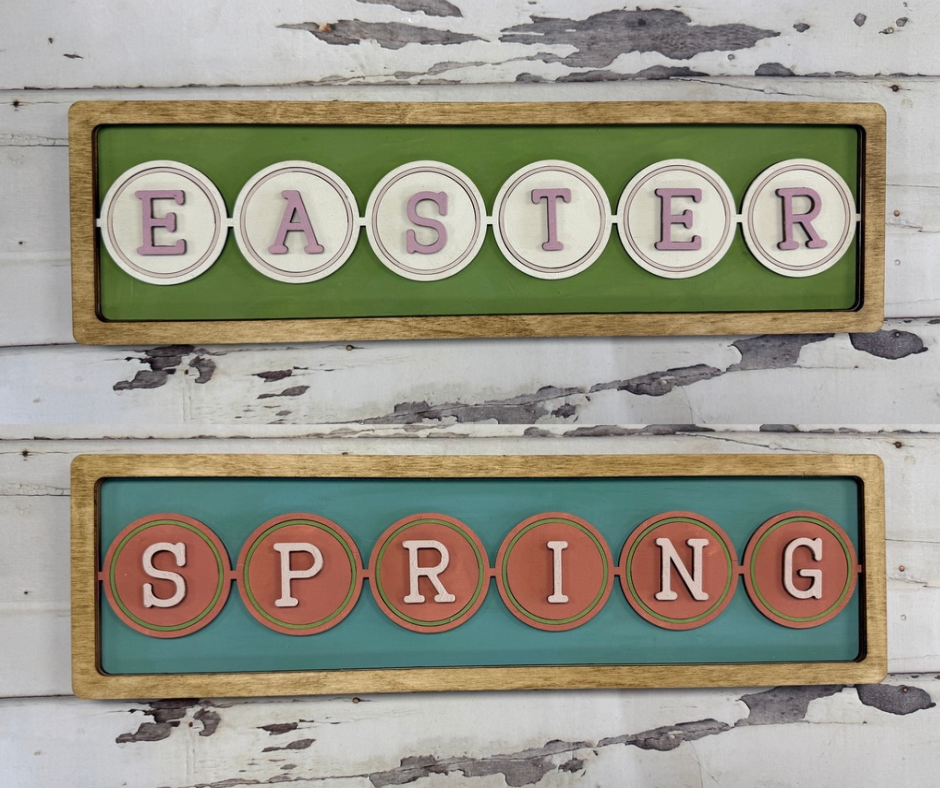 Decorative signs with 'Easter' and 'Spring' text on a wooden frame against a rustic background.
