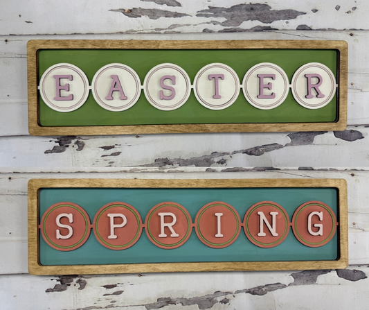 Decorative signs with 'Easter' and 'Spring' text on a wooden frame against a rustic background.